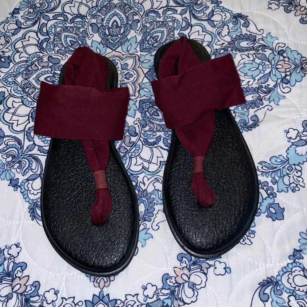 Maroon Yoga sandals.